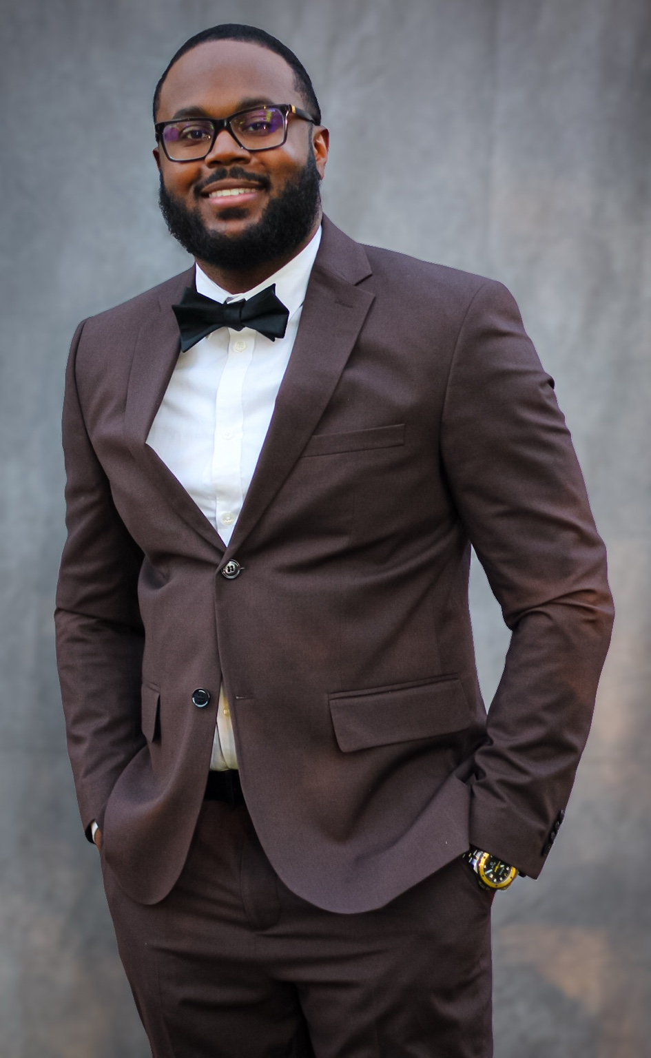 Justin Grant smiling in a suit